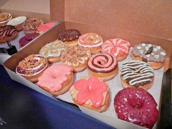 A dozen donuts in a box