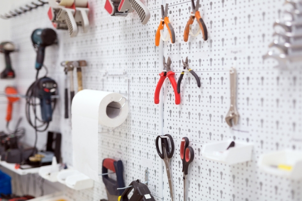 Makerspace tools hanging on a pegboard