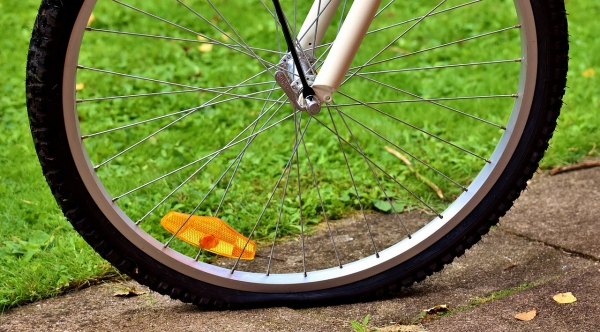 A bicycle tire that is getting flat 